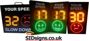 two smiley face speed signs
